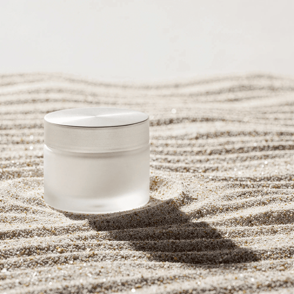 Concept rendering of an unbranded frosted glass jar in pale sand.